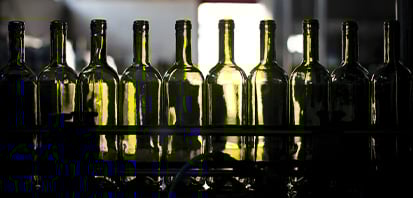 a line of empty wine bottles