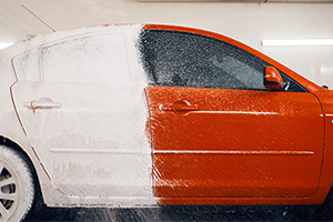 red car with soap on back end